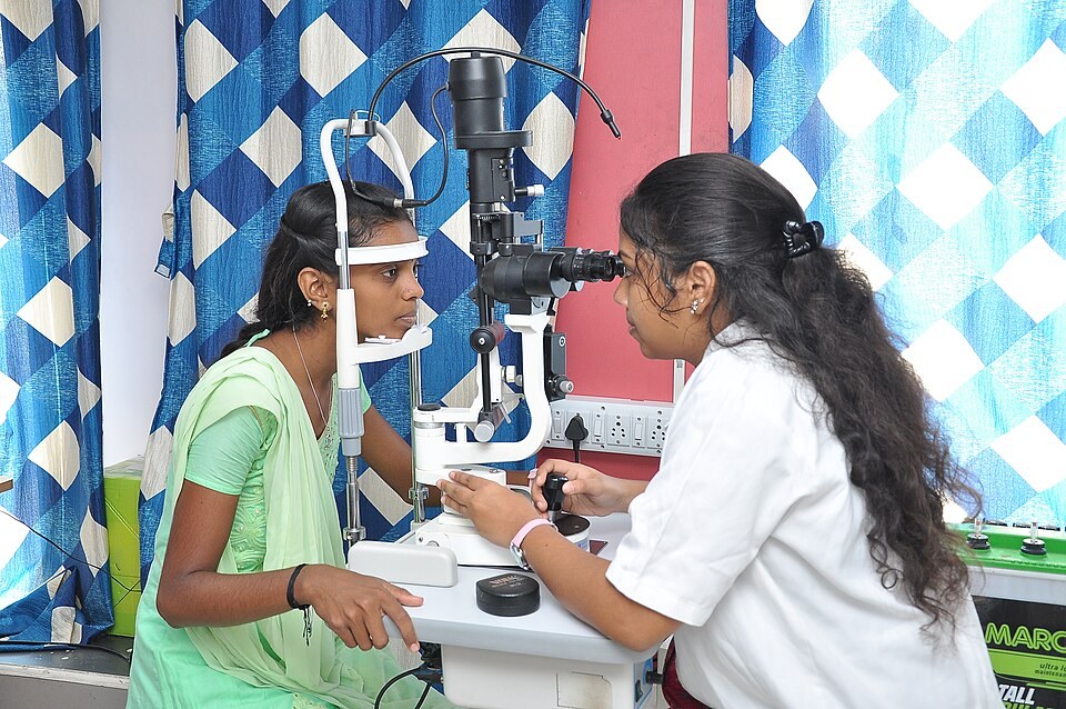 An eye doctor examining a patient's eyes