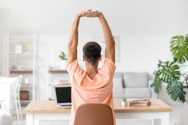 a guy stretching his spine as an exercise