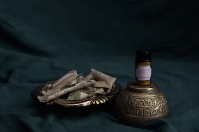a bottle of LSD powder on top of a vintage metal container