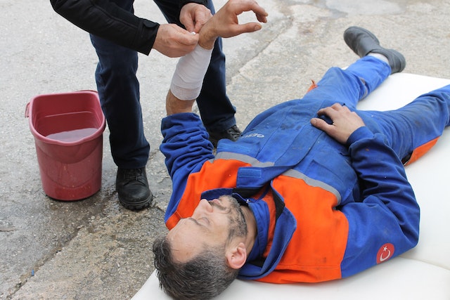an injured man receiving first aid treatment