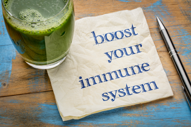 a glass of green smoothie to boost immune system