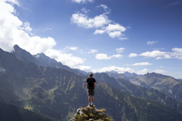 a guy standing over a summit