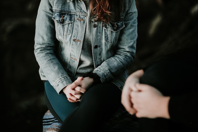 a young girl talking to a health professional