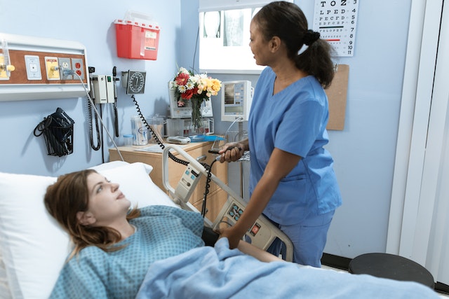 a nurse attending to a patient