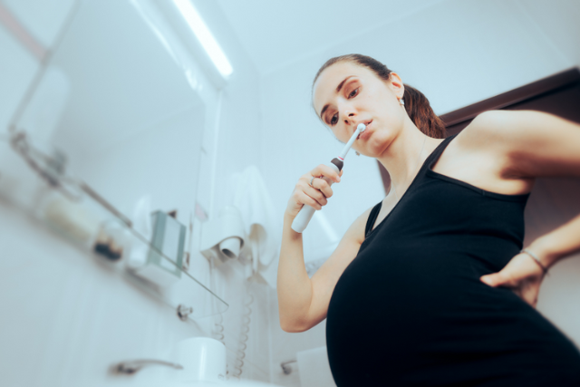preggy mom brushing teeth
