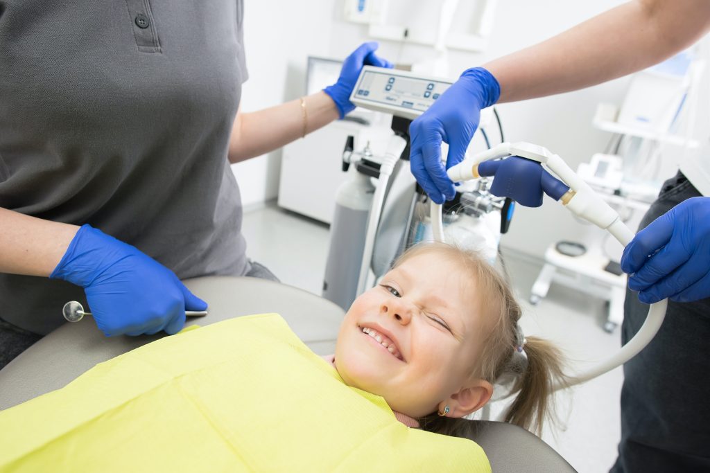 young girl with dentist
